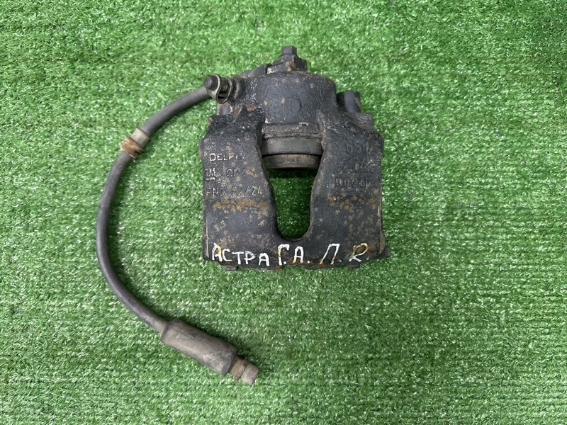 Суппорт тормозной Opel Astra