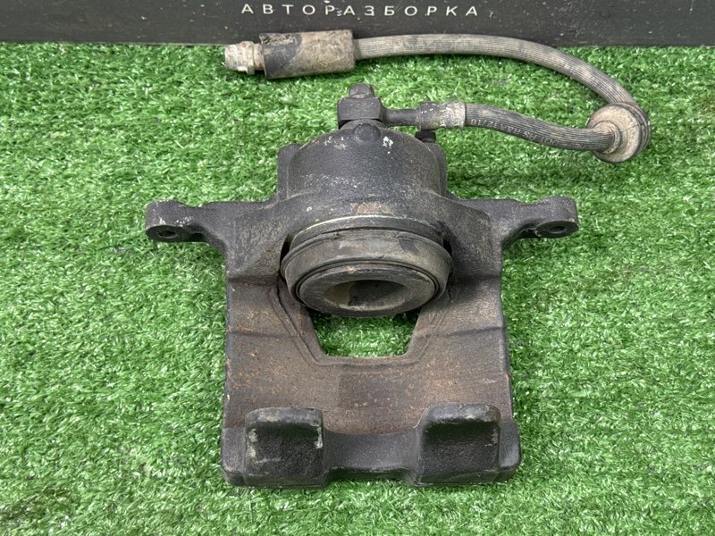 Суппорт тормозной Opel Astra J