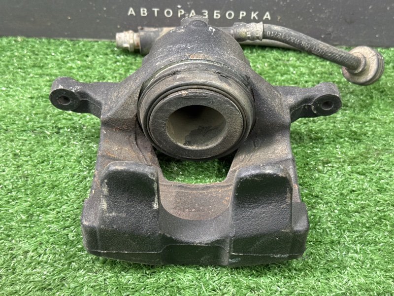 Суппорт тормозной Opel Astra J