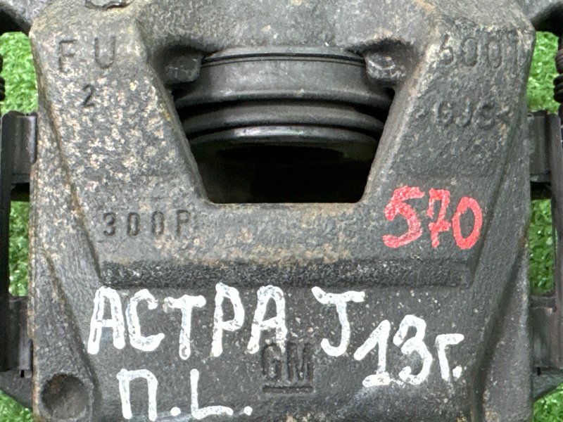 Суппорт тормозной Opel Astra J