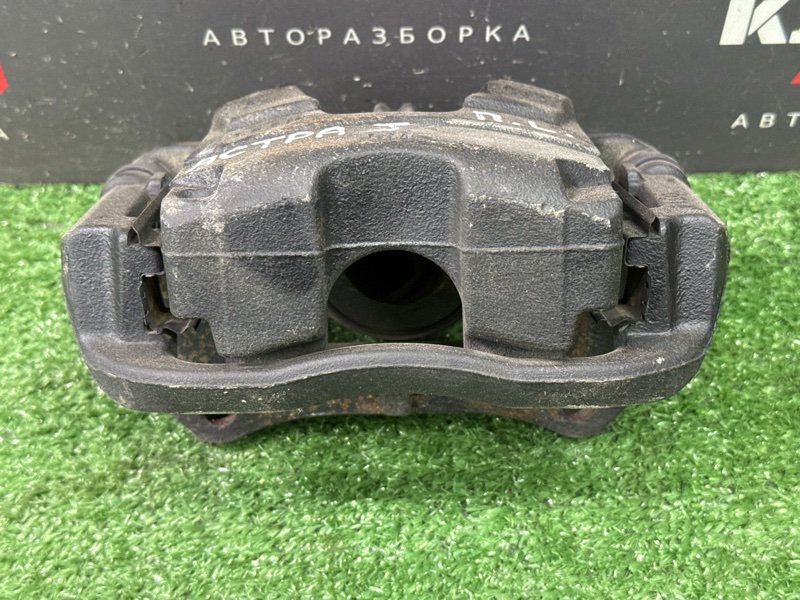 Суппорт тормозной Opel Astra J