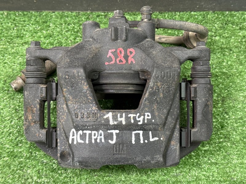 Суппорт тормозной Opel Astra J