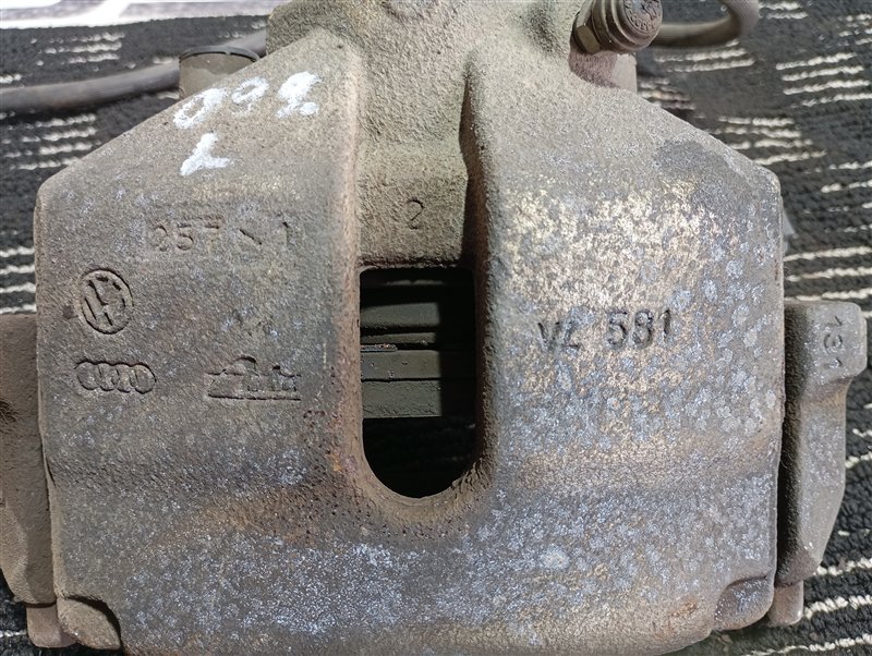Суппорт тормозной Volkswagen Passat 2012 B7