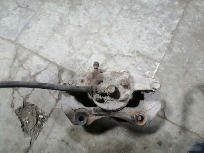 Суппорт тормозной Mitsubishi Lancer 9