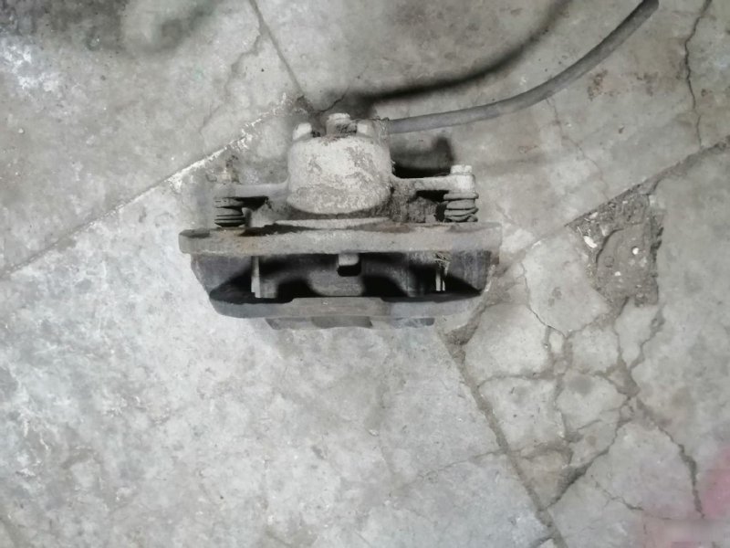 Суппорт тормозной Mitsubishi Lancer 9