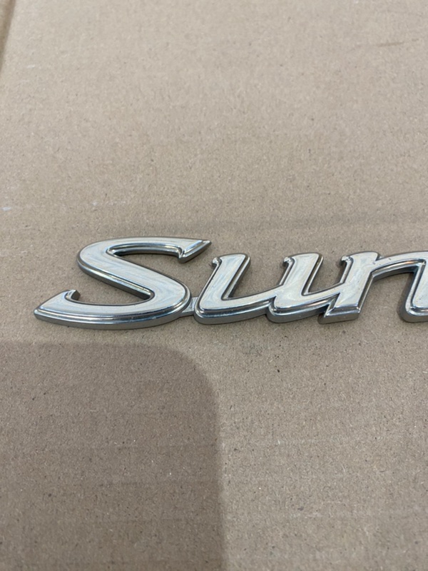 Эмблема Nissan Sunny 1999 GF-FB15
