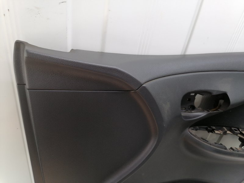 Обшивка двери Toyota Corolla E150