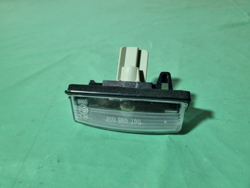 Фонарь подсветки номера Nissan Tiida C11 2013